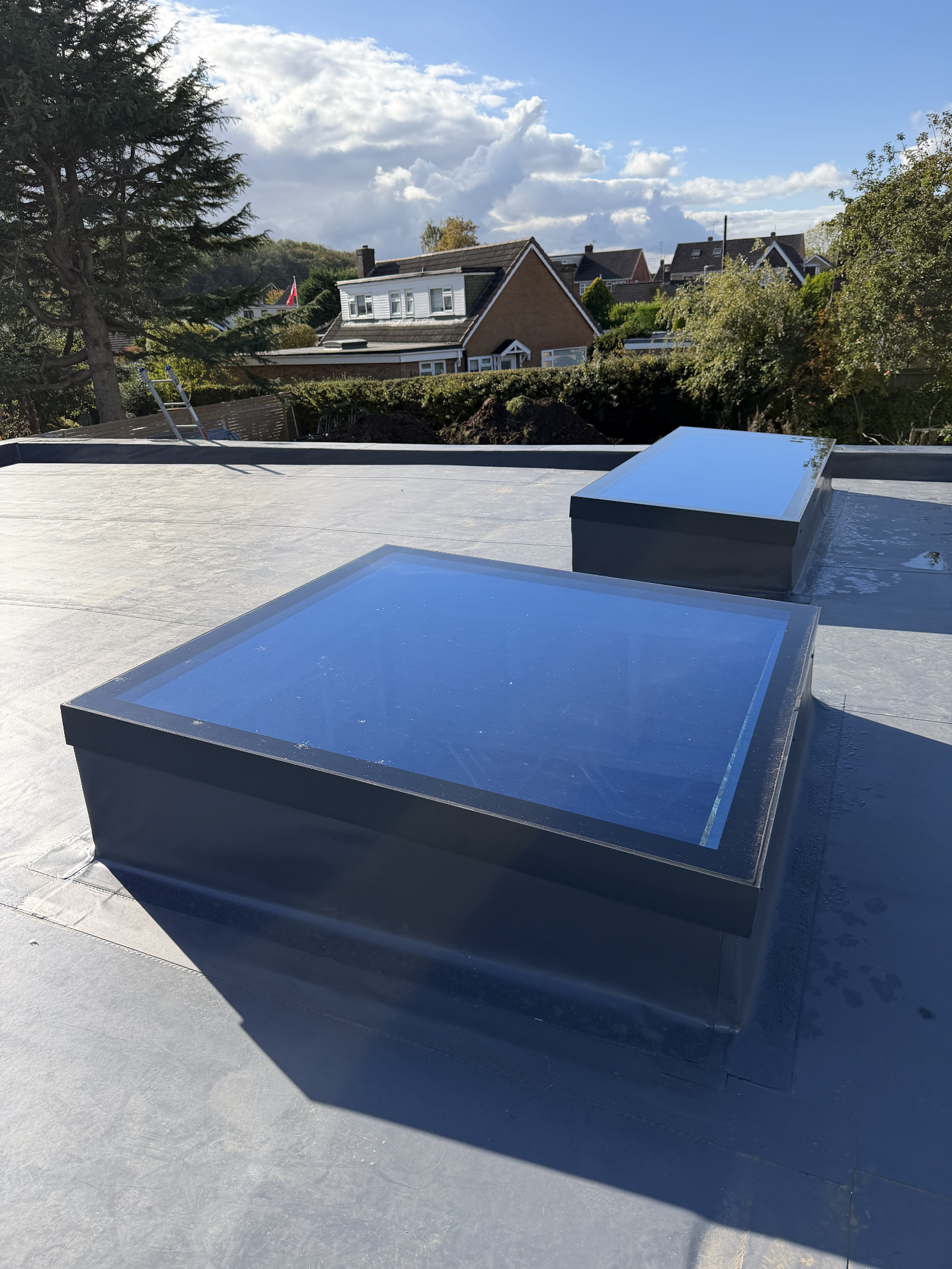 Infinity frameless flat rooflight above a kitchen, installed by WGS Glazing